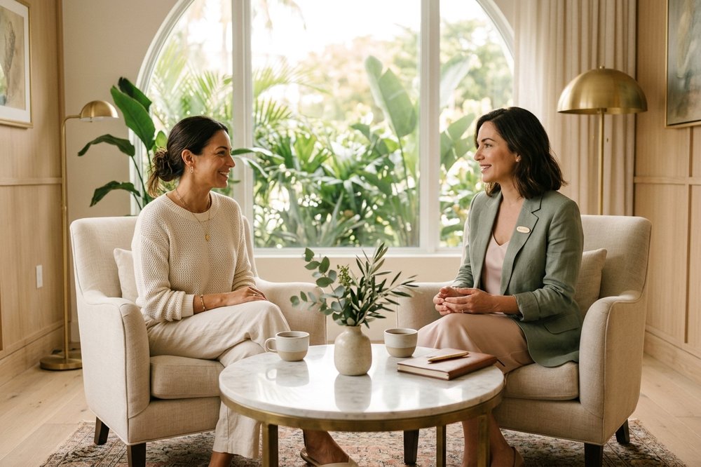 A surgeon and patient in calm conversation in a modern consultation room